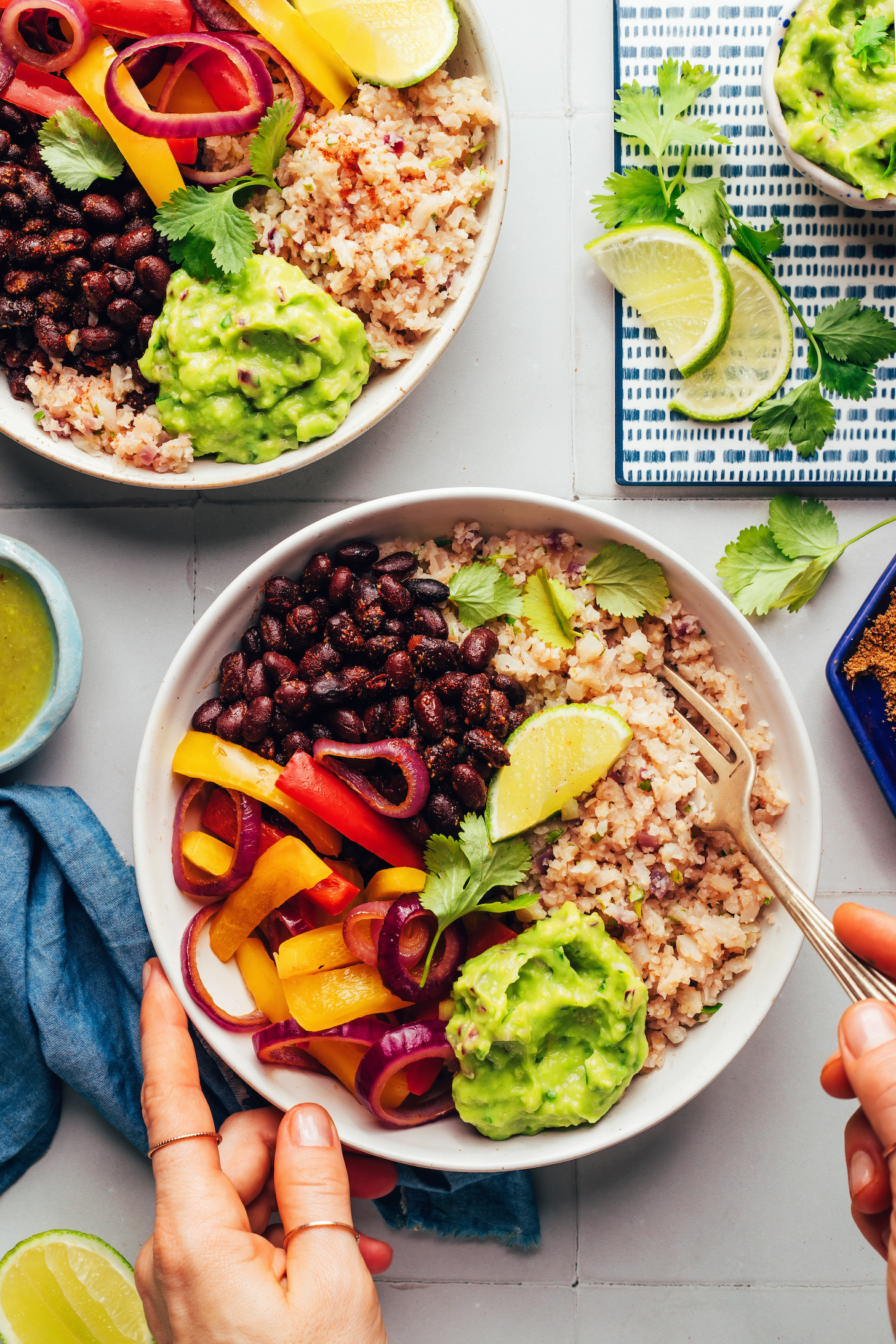 Overhead photo of two bowls of our cauliflower rice burrito bowl recipe