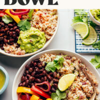 Two servings of our vegan gluten-free cauliflower rice burrito bowls next to lime slices, cilantro, and guacamole