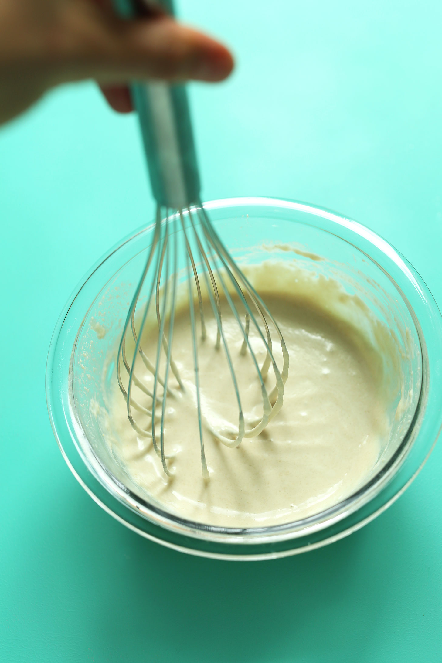Whisking vegan tahini sauce to be added to nearly any plant-based meal