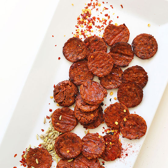 Tray with homemade Vegan Pepperoni, fennel seeds, and red chili flakes