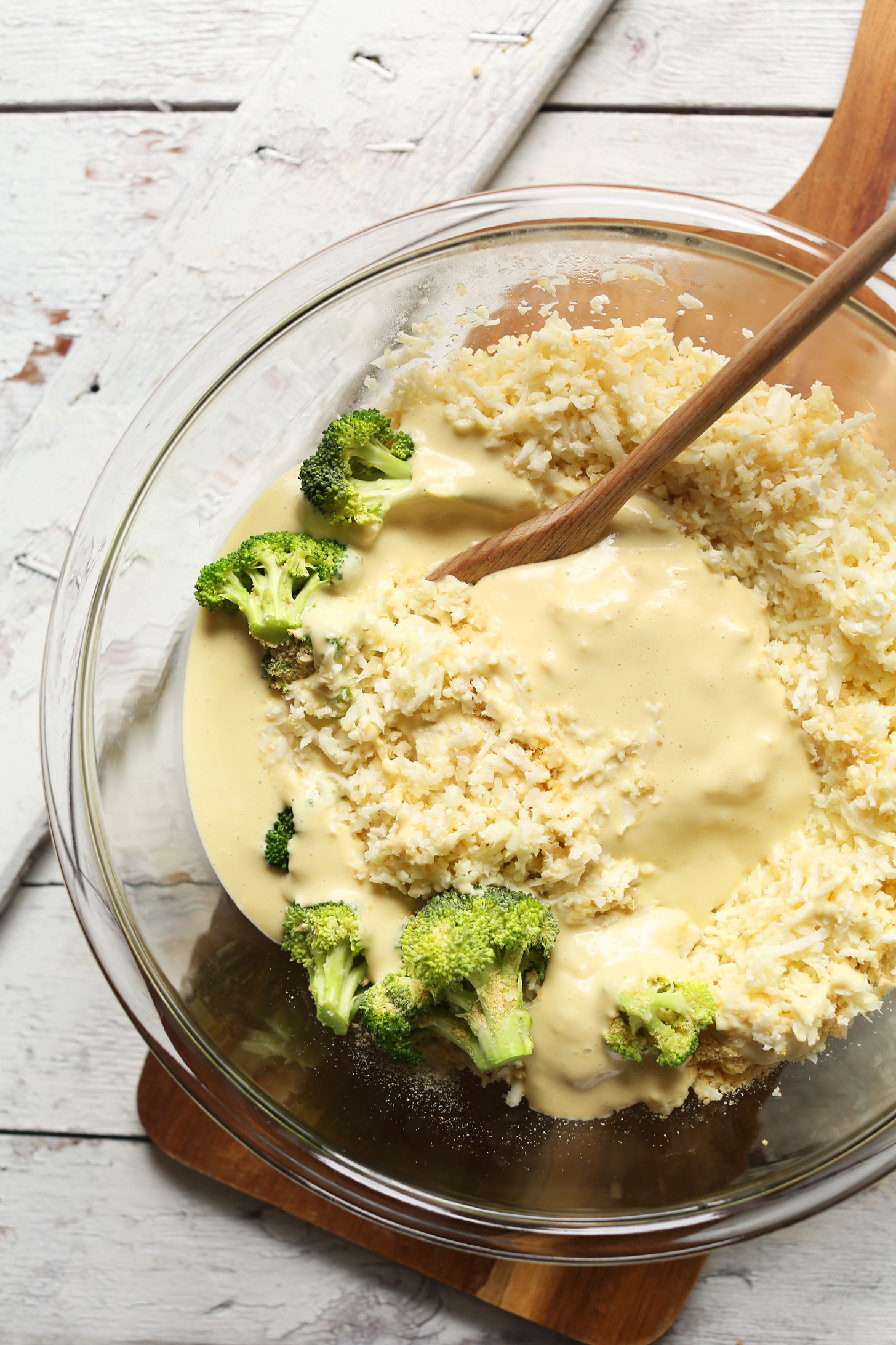Stirring together ingredients for our gluten-free plant-based Cheesy Cauliflower Rice Broccoli Bake