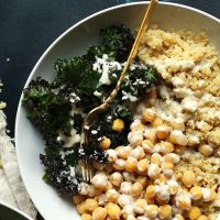 Fork resting in a big bowl of our Chickpea Quinoa Buddha Bowl recipe