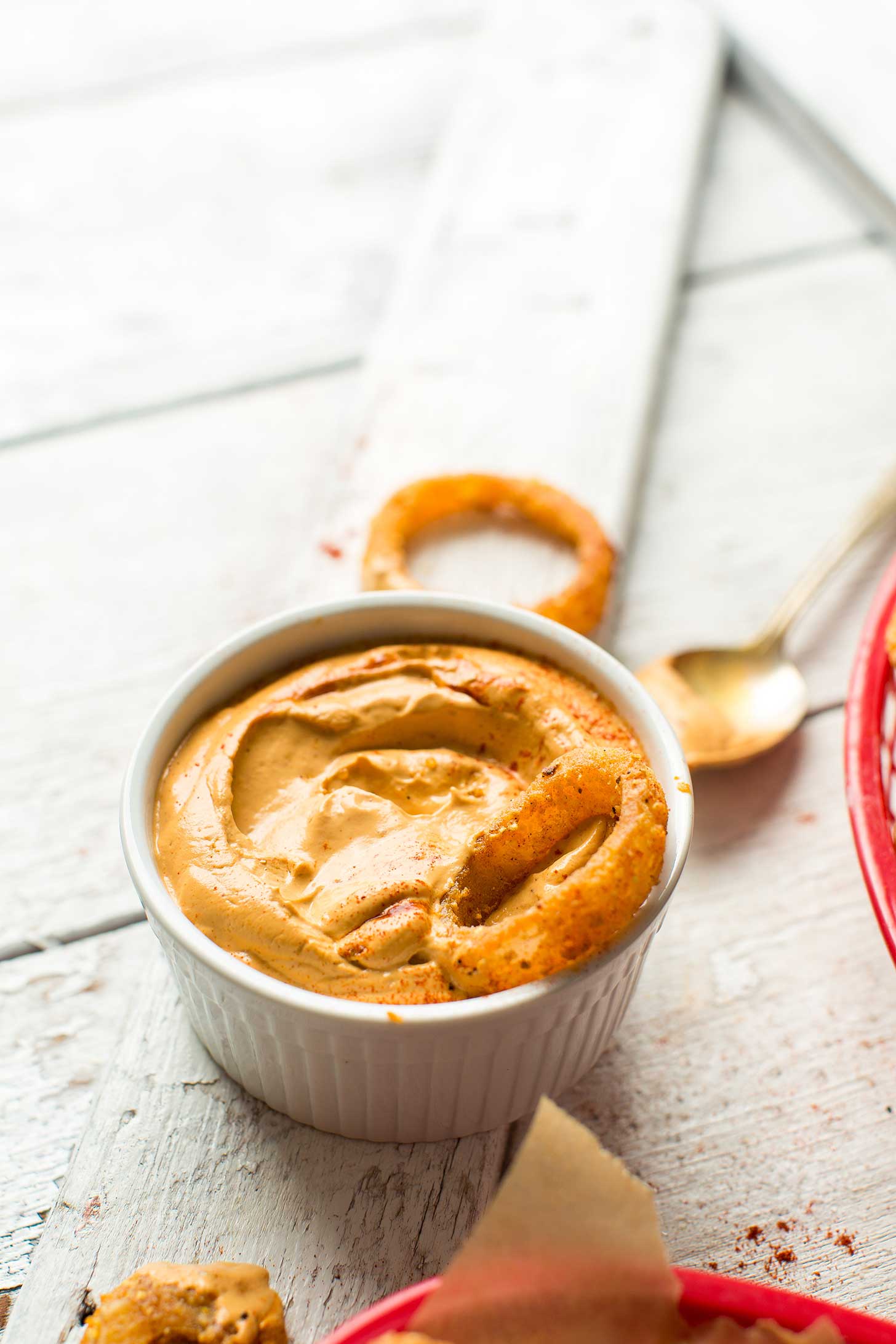 A bowl of Vegan Chipotle Aioli dipping sauce for homemade gluten-free onion rings