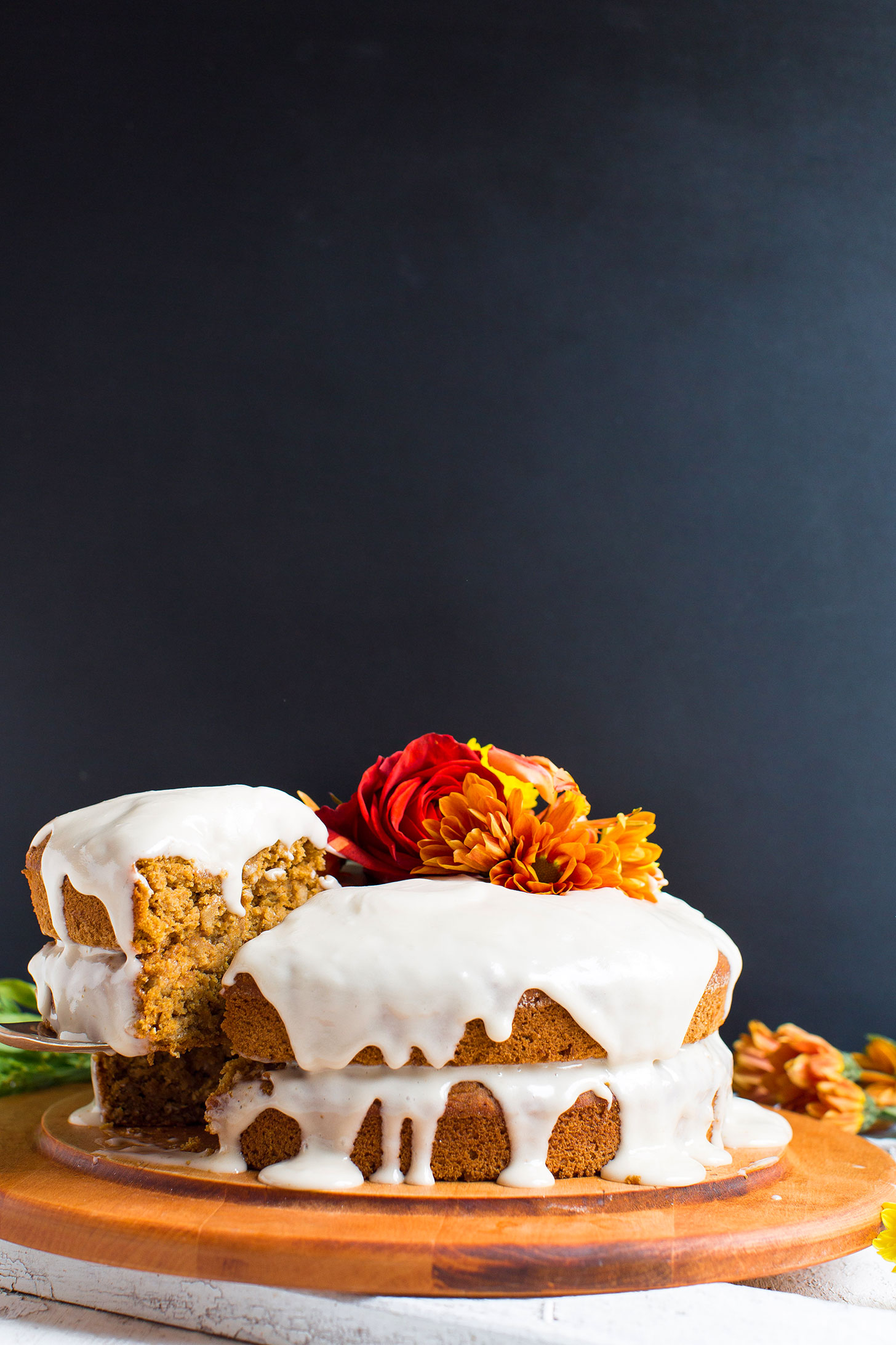 Our gluten-free vegan Pumpkin Cake recipe with glaze and decorated with flowers
