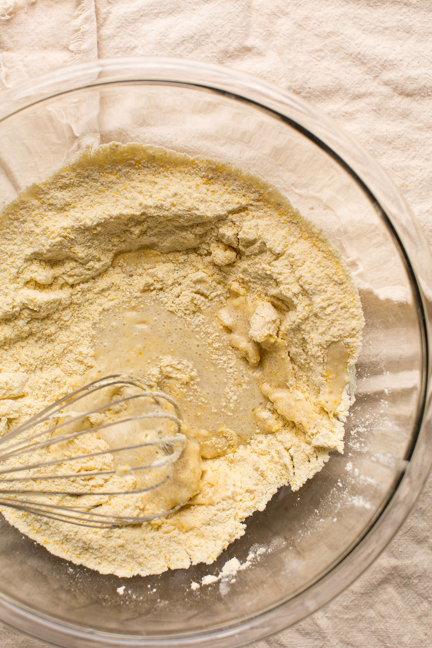 Whisking wet ingredients into dry for crumbly gluten-free vegan cornbread