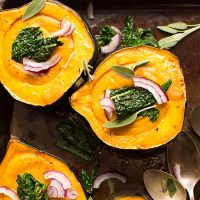 Baking sheet of Acorn Squash Bowls filled with creamy fall soup