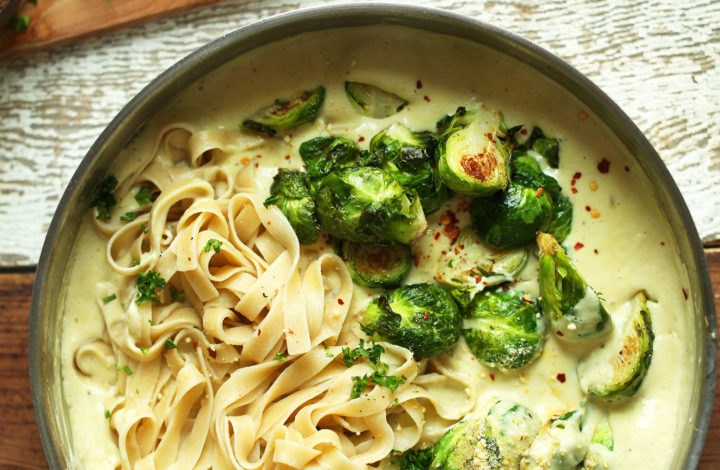 Stirring a pan of White WIne + Garlic Pasta with Roasted Brussels Sprouts