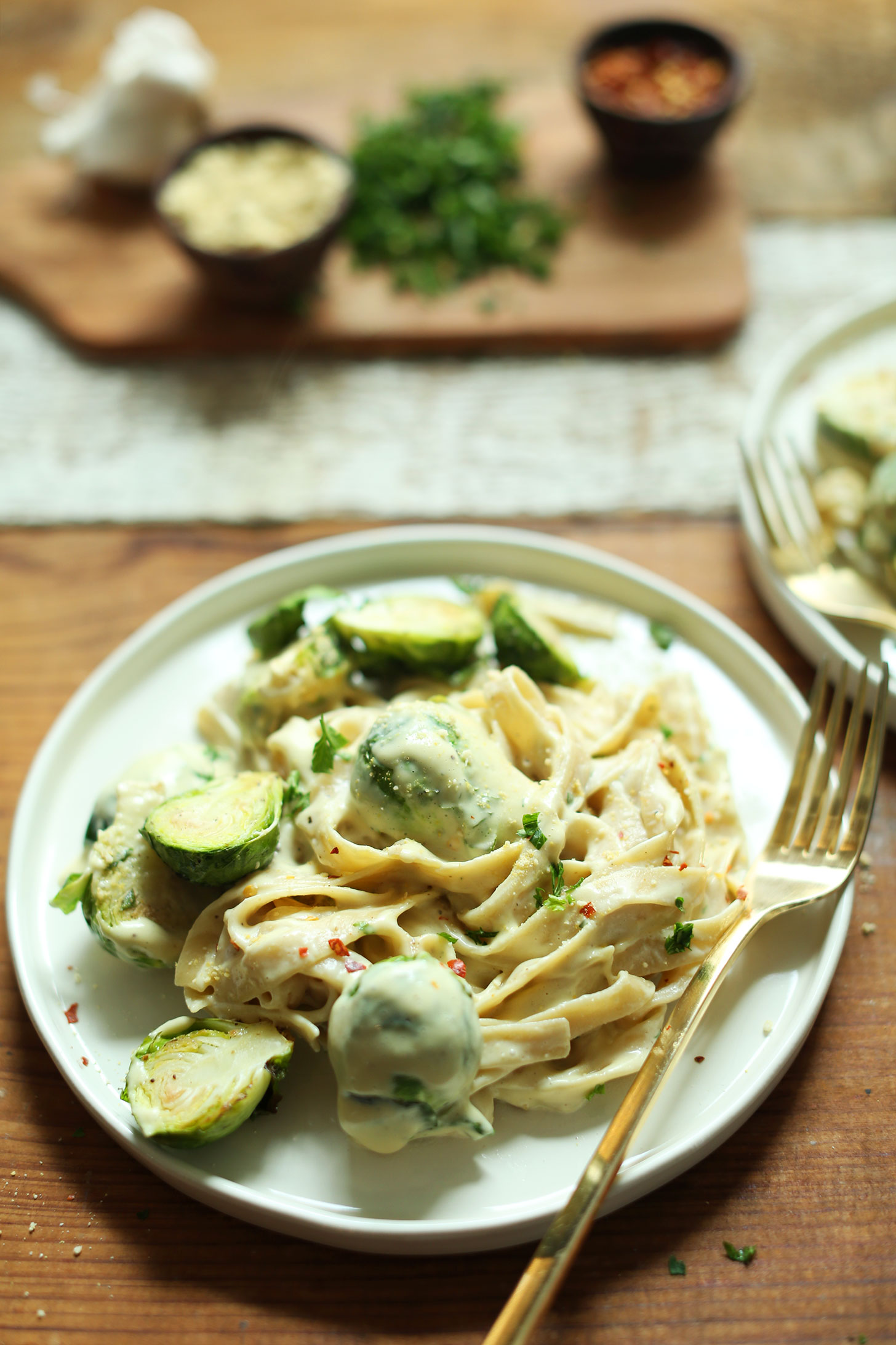 Hearty serving of our comforting recipe of Vegan Garlic Alfredo Pasta with Roasted Brussels Sprouts