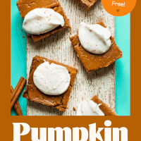 Creamy vegan gluten-free pumpkin pie bars on a wood plank