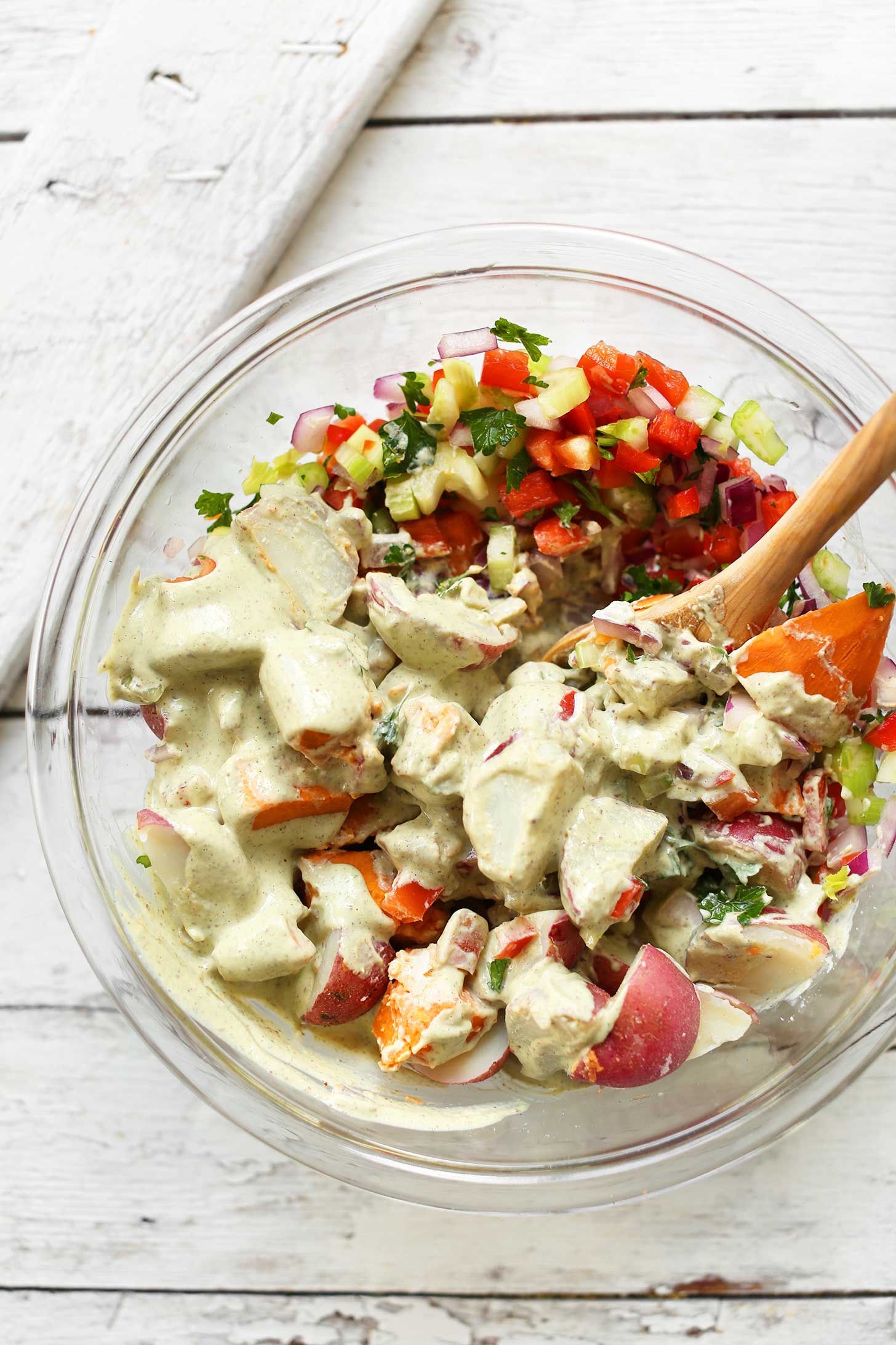 Stirring together ingredients for our healthy plant-based Potato Salad recipe