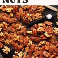 Pan of our easy candied spiced nuts with text saying perfect for the holidays