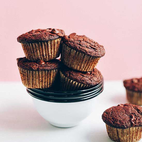 Stack of bowls piled high with Gluten-Free Chocolate Chocolate Chip Muffins