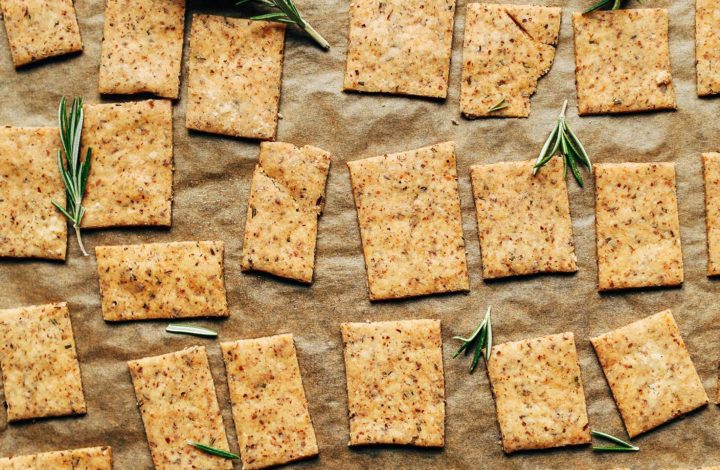 Baking sheet filled with crispy Gluten-Free Vegan Rosemary Crackers