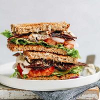 Stacked halves of a Vegan BLT Sandwich on a plate