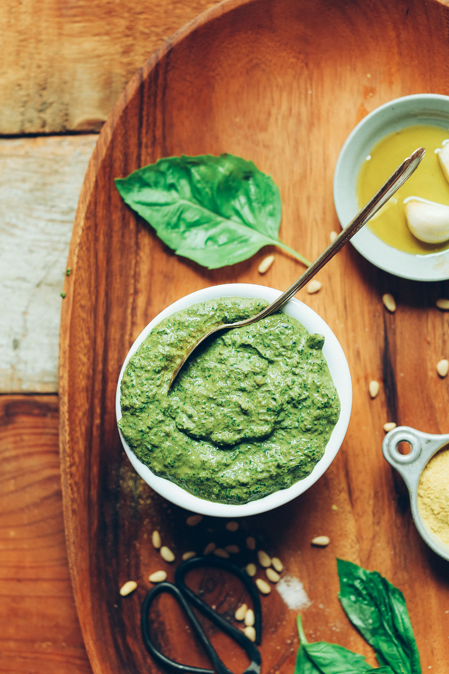 Grabbing a spoonful of our homemade vegan pesto recipe for making a plant-based meal