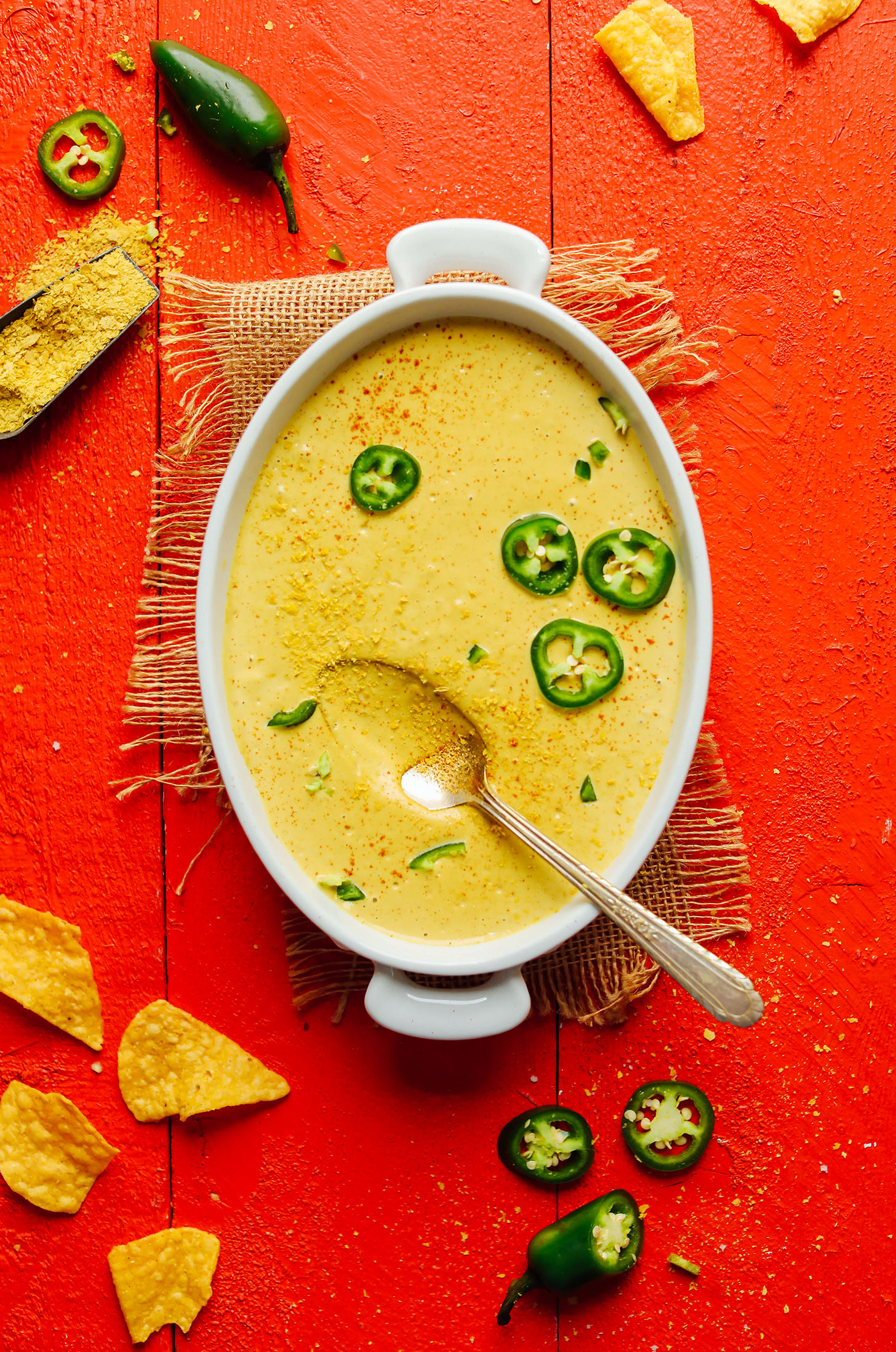 Serving dish filled with Creamy Roasted Jalapeno Vegan Queso cheese dip