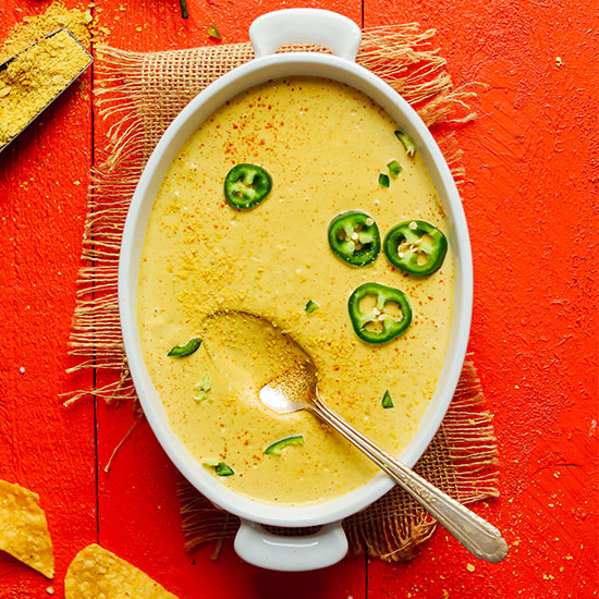 Ceramic baking dish filled with Creamy Roasted Jalapeno Vegan Queso