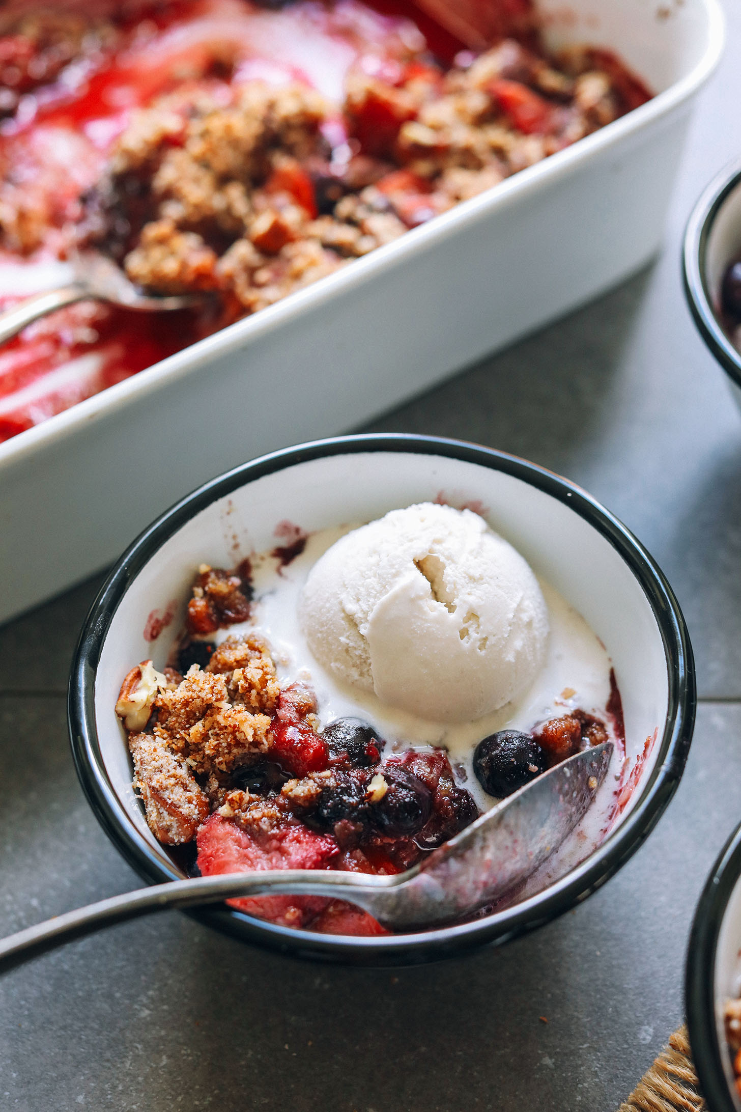 Close up shot of a bowl of gluten-free berry crisp for a delicious healthy dessert