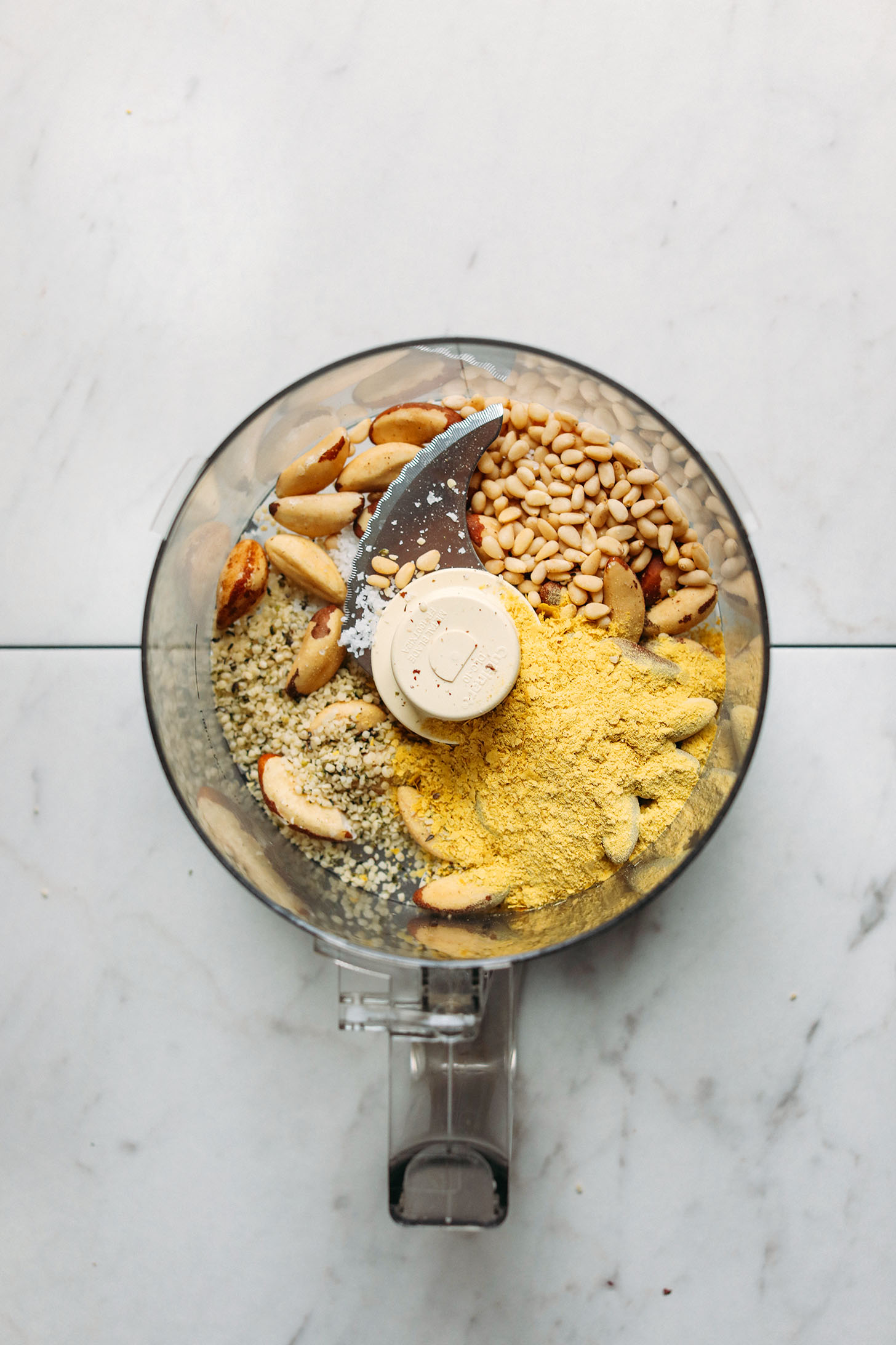 Ingredients in a food processor for Vegan Parmesan Cheese