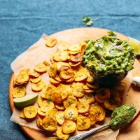 Display of Baked Plantain Chips and Garlicky Guac for a healthy plant-based snack