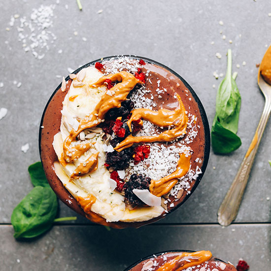 PBJ Açaí Bowl topped with sliced banana, berries, coconut, and nut butter