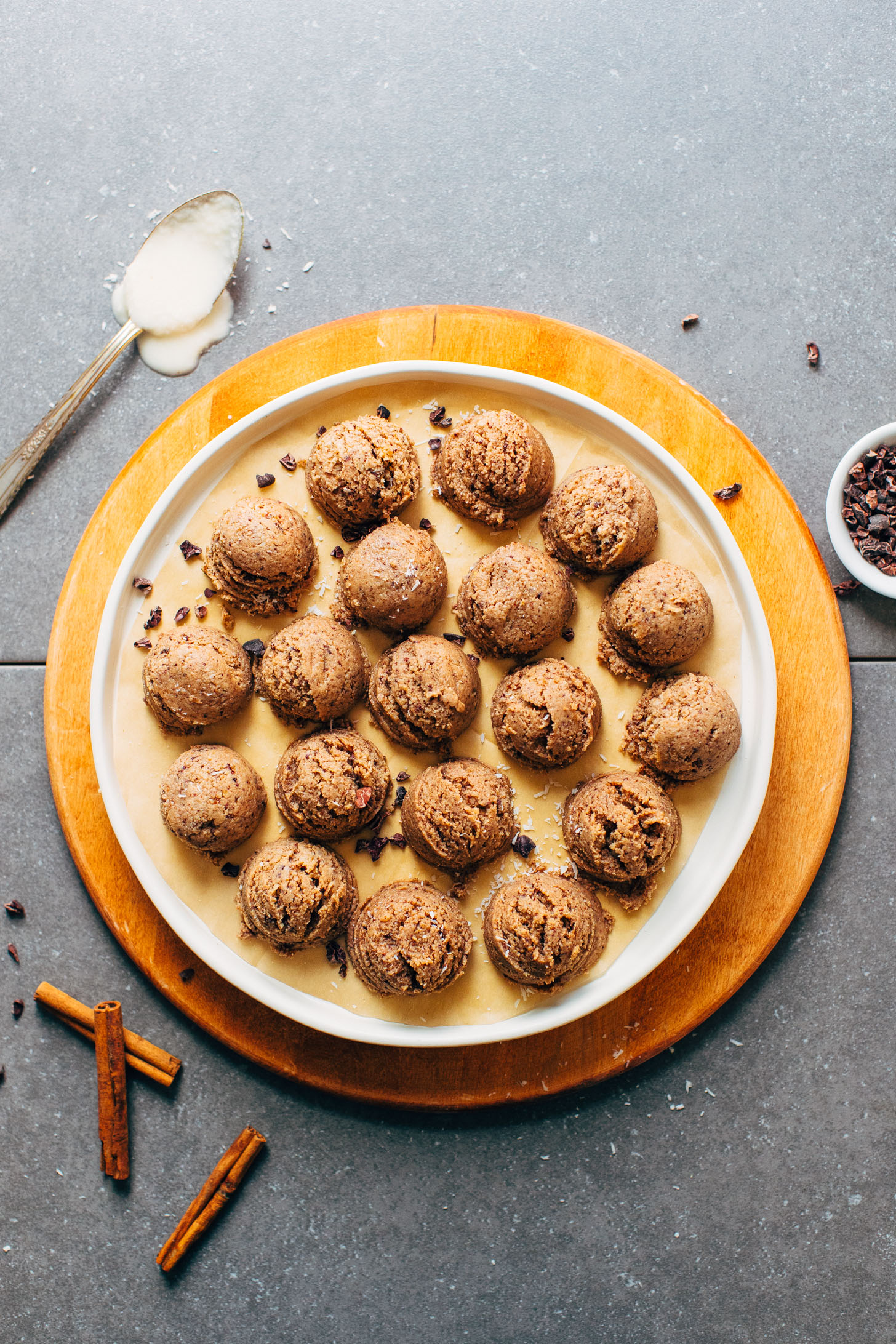 Plate full of Chocolate Coconut Tahini Power Bites ready to be devoured for a delicious plant-based snack