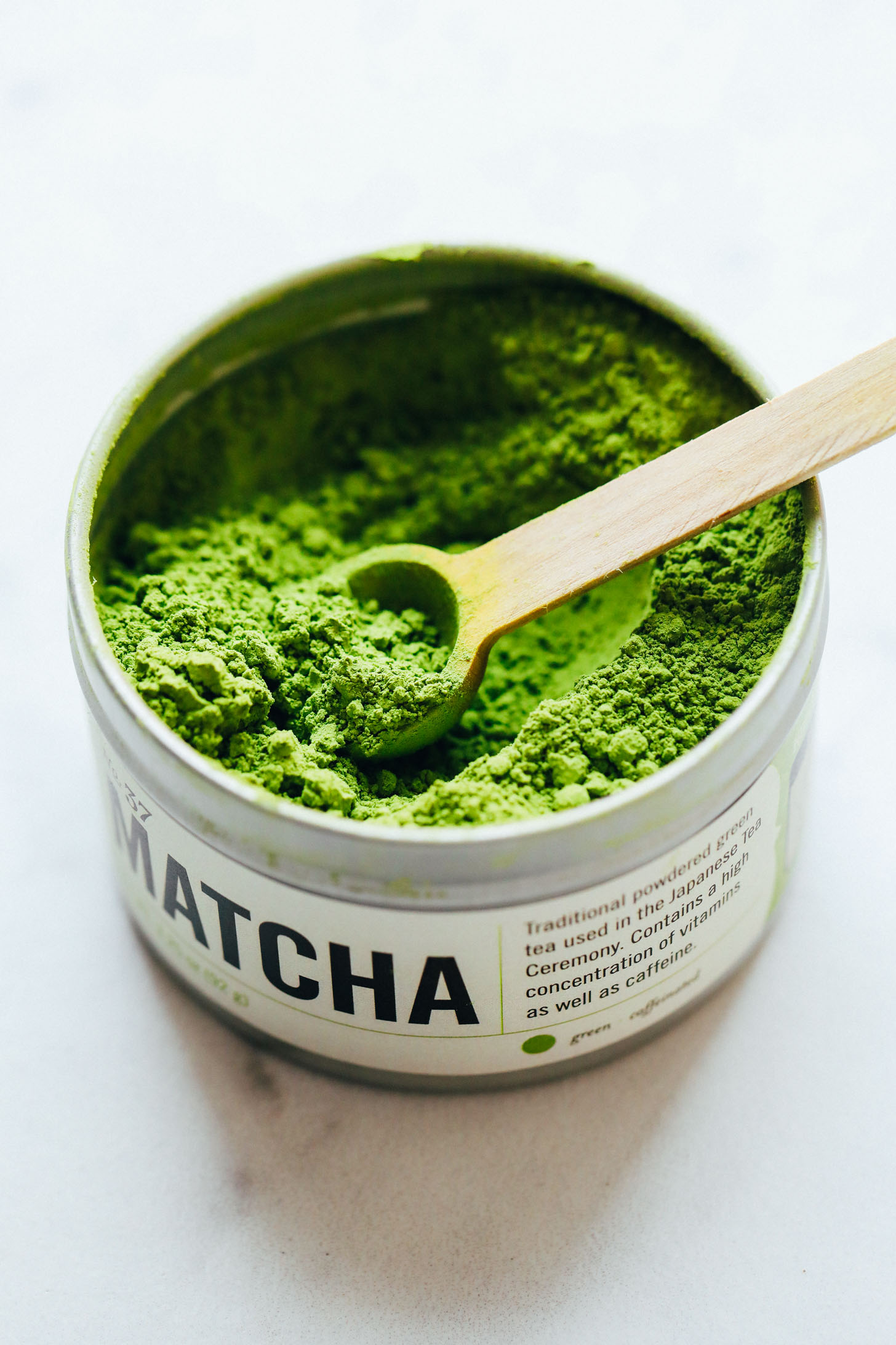 Spoon in a tin of matcha
