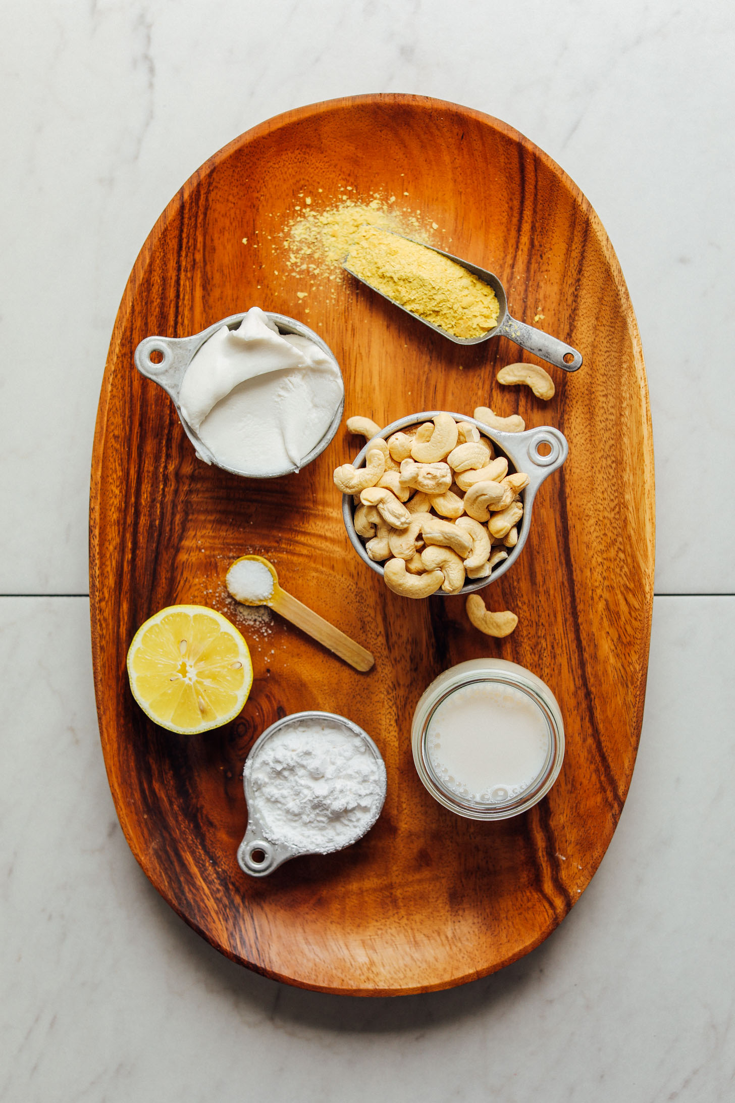 Wood platter with ingredients for making Vegan Mozzarella Cheese
