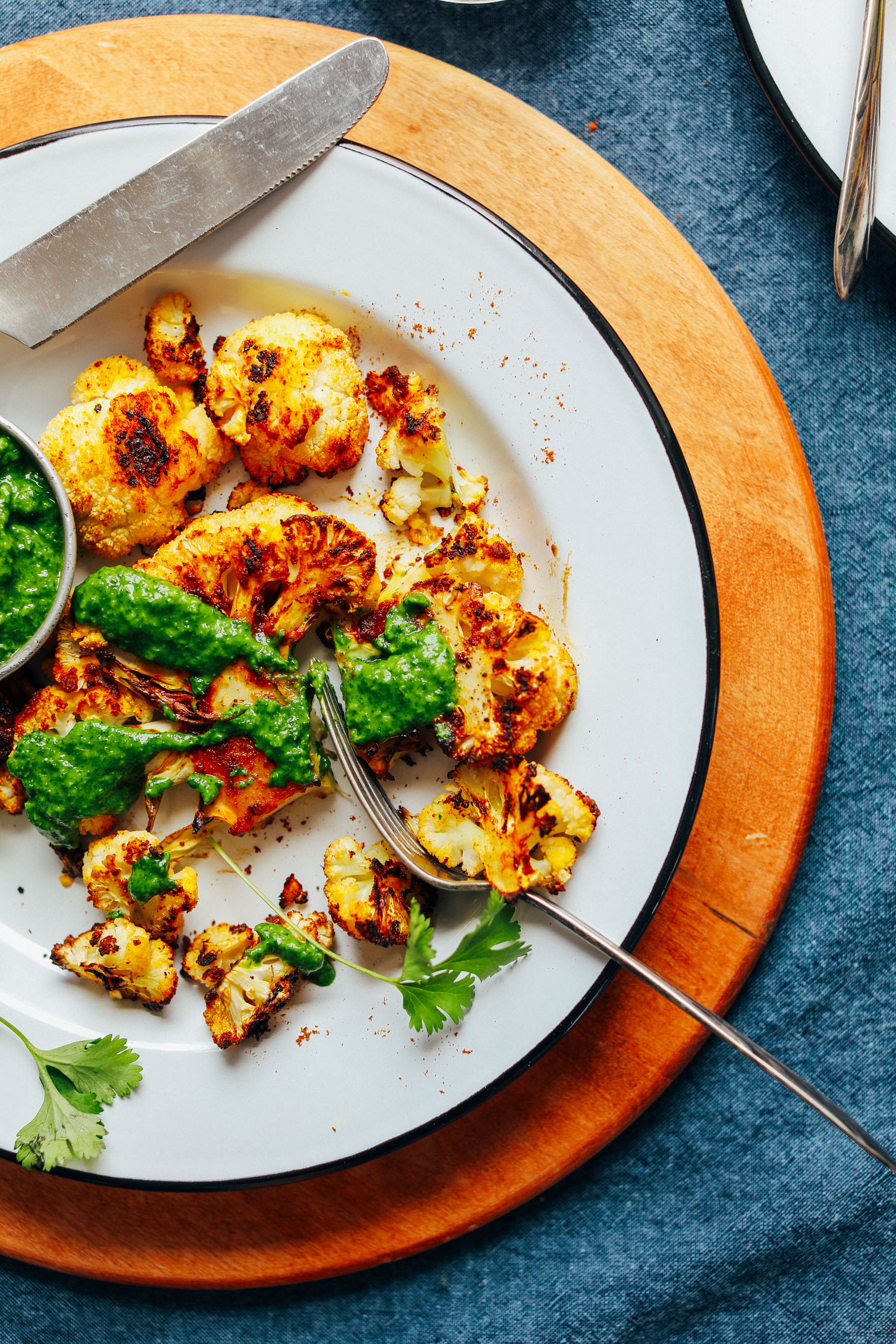 Plate with Shawarma Roasted Cauliflower Steak and Green Chutney for a delicious plant-based meal