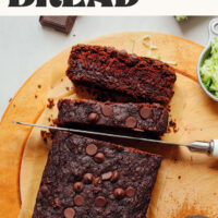 Cutting slices of our delicious vegan and gluten-free double chocolate zucchini bread