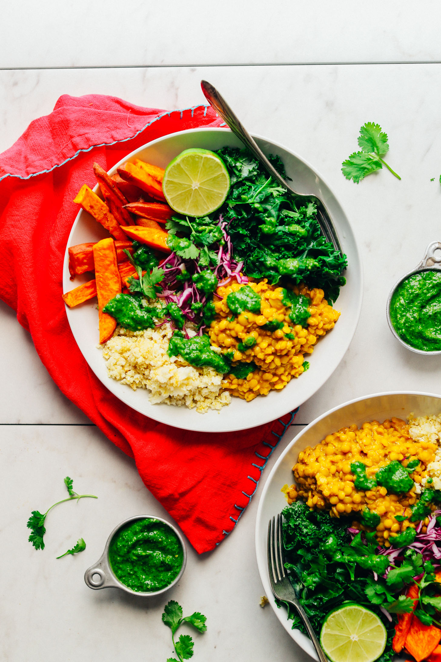 Big serving of our Curried Lentil Sweet Potato Bowl with a lime for serving