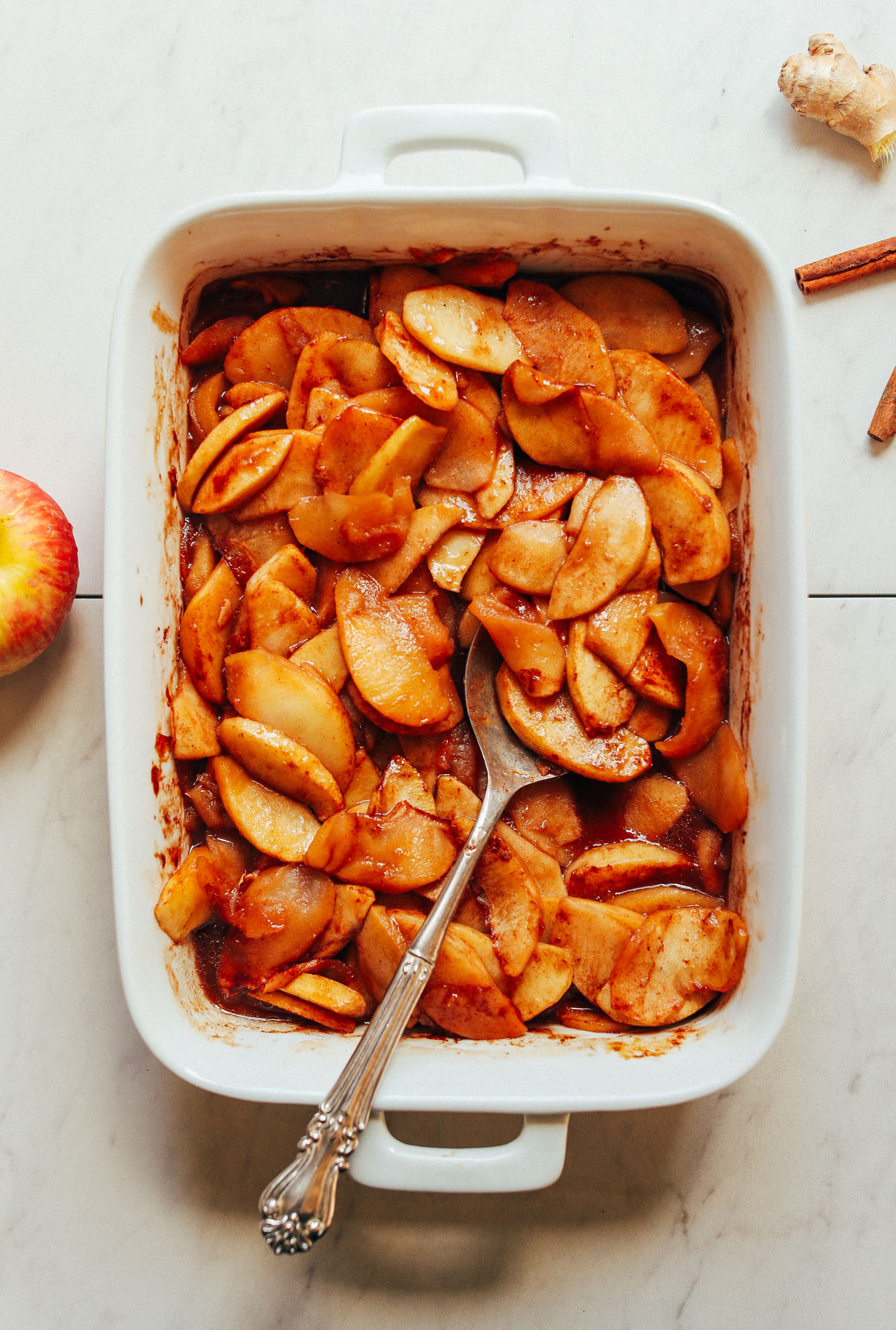 Freshly stirred sliced apples with spices for making naturally-sweetened Cinnamon Baked Apples