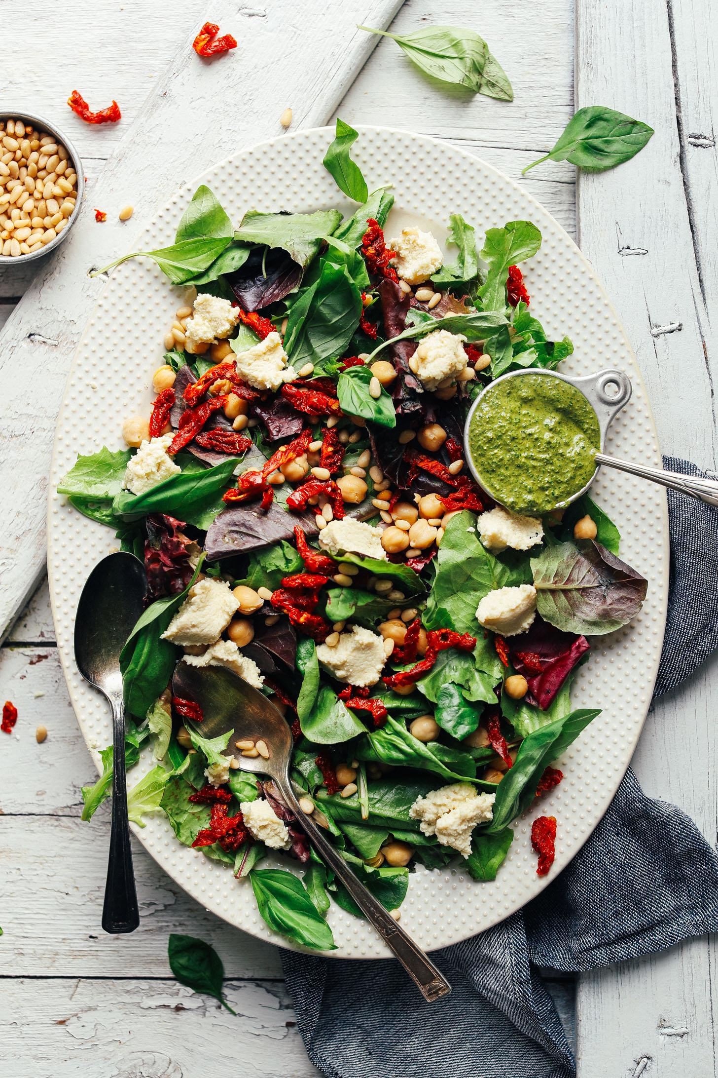 DELICIOUS Green Salad with Almond Ricotta, Vibrant Pesto, and Sundried Tomatoes! 30 minutes, simple ingredients, SO healthy! #vegan #plantbased #pesto #salad #recipe #glutenfree #minimalistbaker