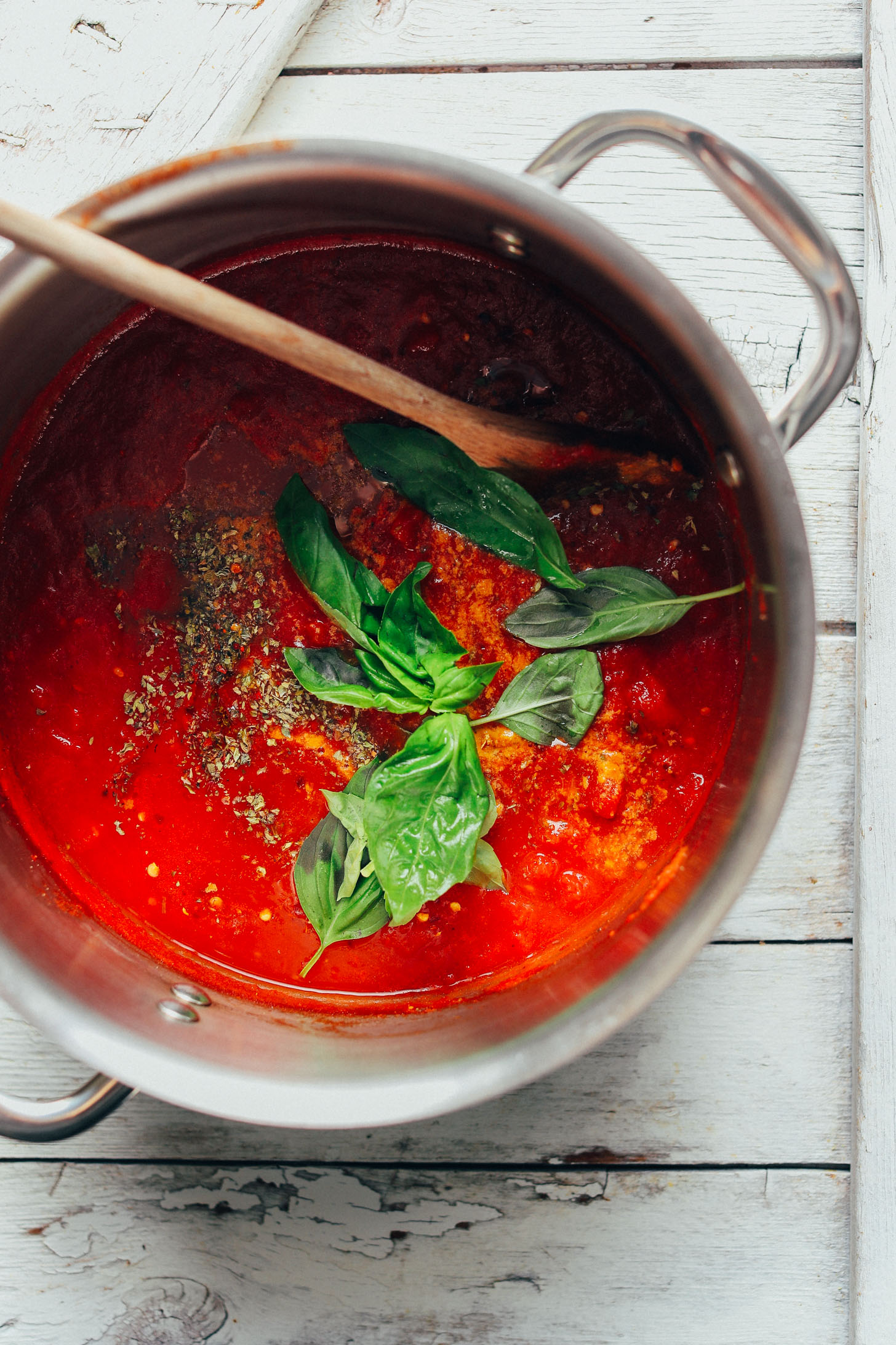 Stirring fresh basil into our Easy 1-Pot Marinara Sauce