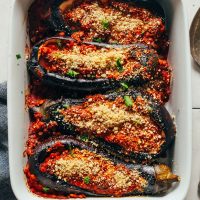 Ceramic baking dish with Moroccan Lentil-Stuffed Eggplant for a healthy plant-based meal