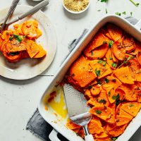 Plate and pan of our gluten-free Butternut Squash Gratin recipe