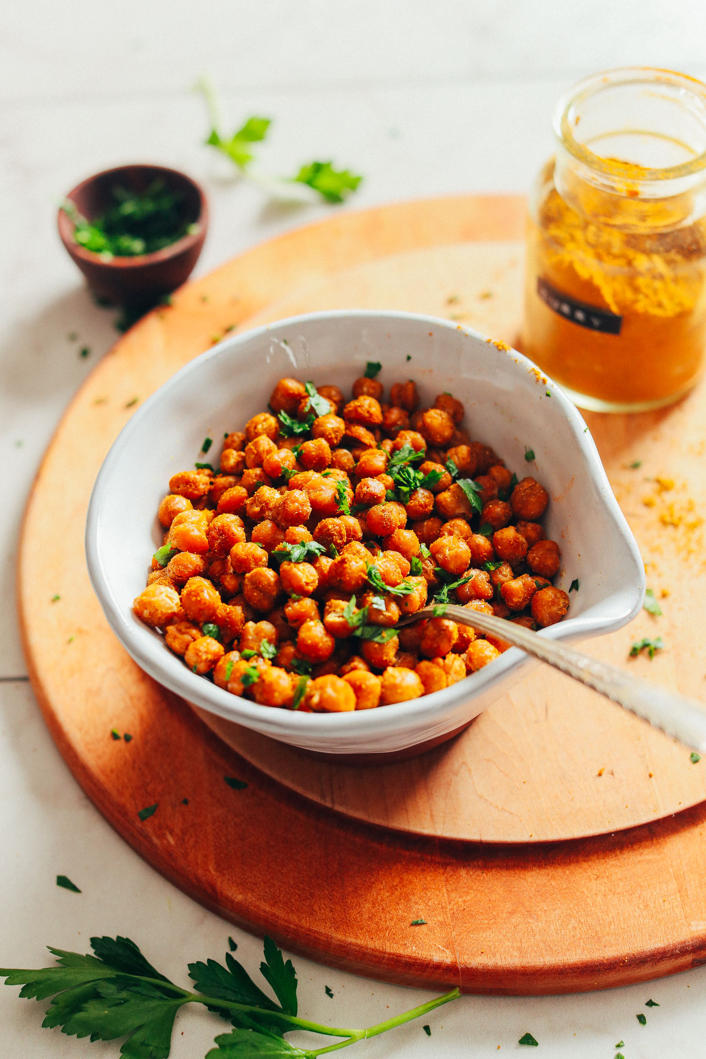 Bowl of our EASY Crispy Roasted Chickpeas perfect for snacking or topping plant-based salads