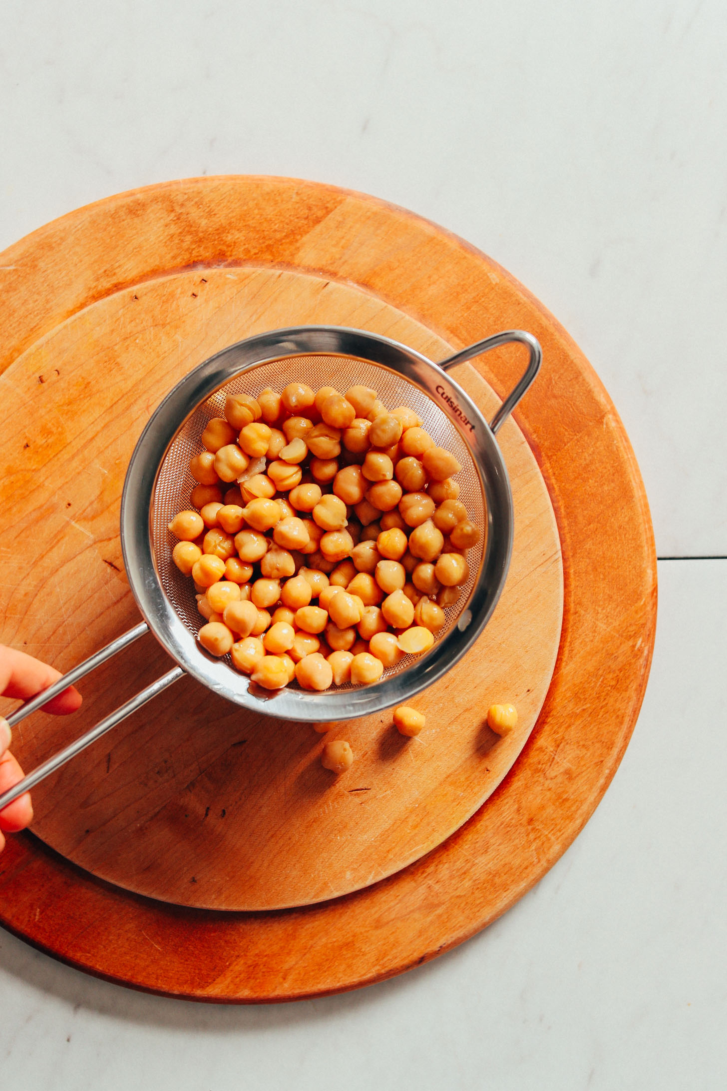 Strainer with chickpeas for making our EASY Crispy Roasted Chickpeas recipe