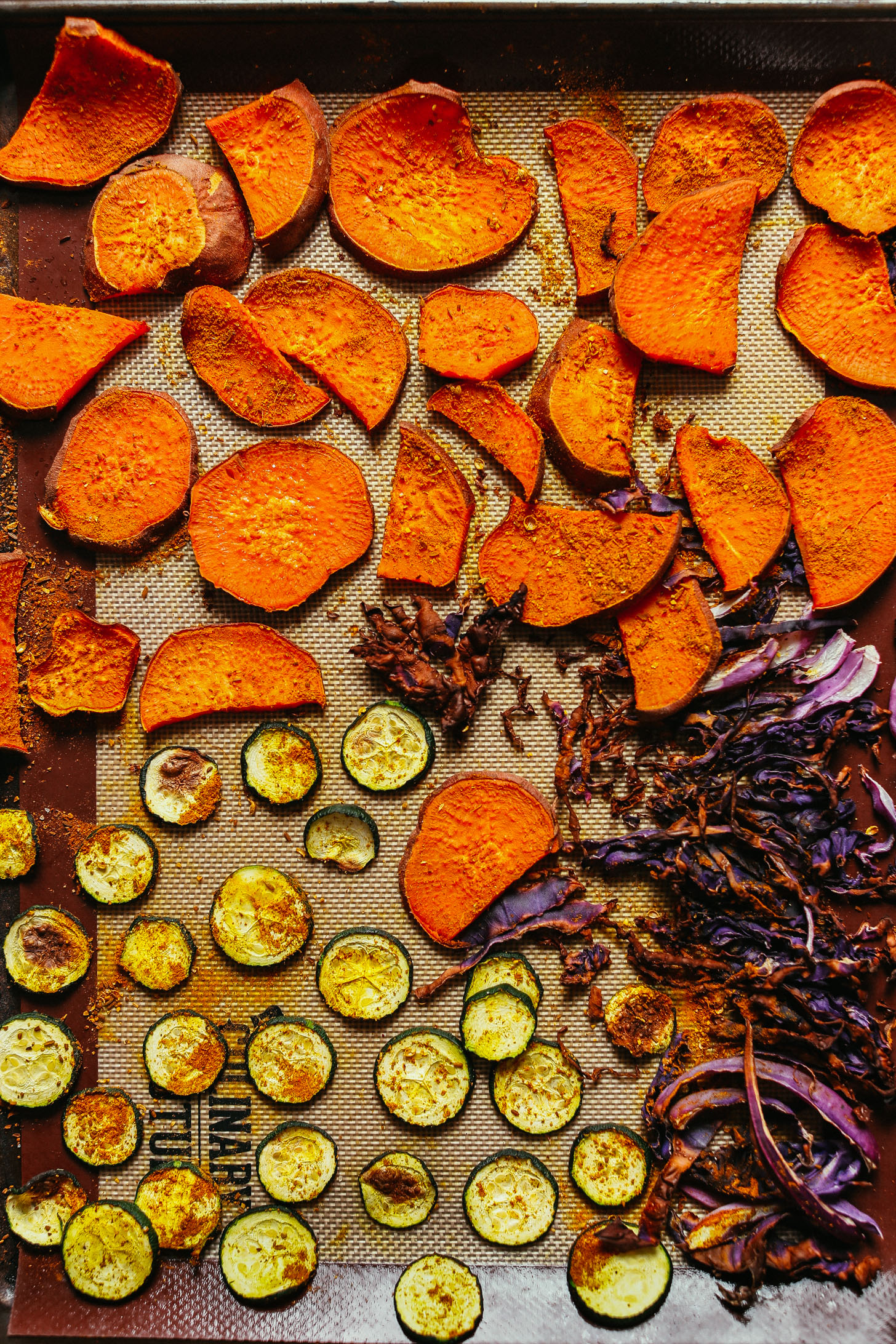 Freshly roasted cabbage, sweet potatoes, and zucchini for our hearty Abundance Green Salad with Savory Tahini Dressing