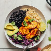 Fiber- and protein-rich ingredients make up this meal of Black Bean Plantain Bowls displayed here