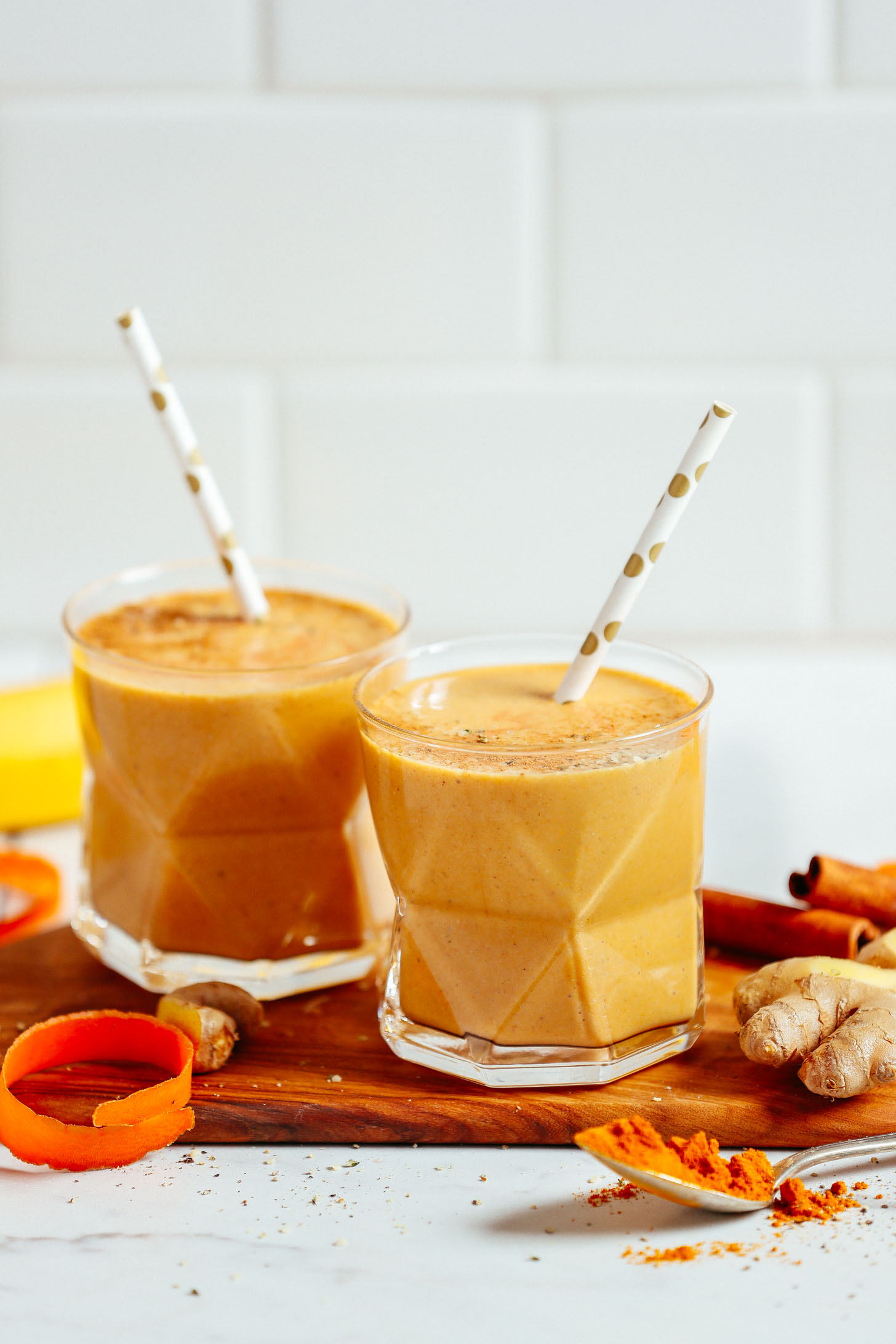 Two glasses of our healthy vegan golden milk smoothie