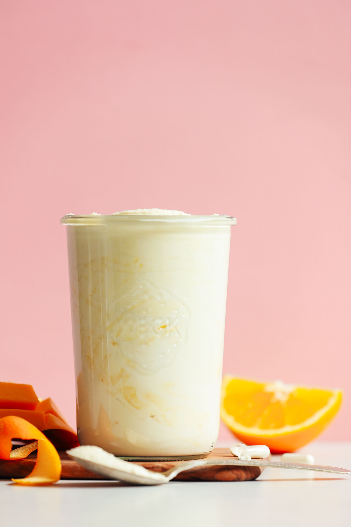 Glass jar filled with homemade probiotic-rich vegan Mango Coconut Yogurt