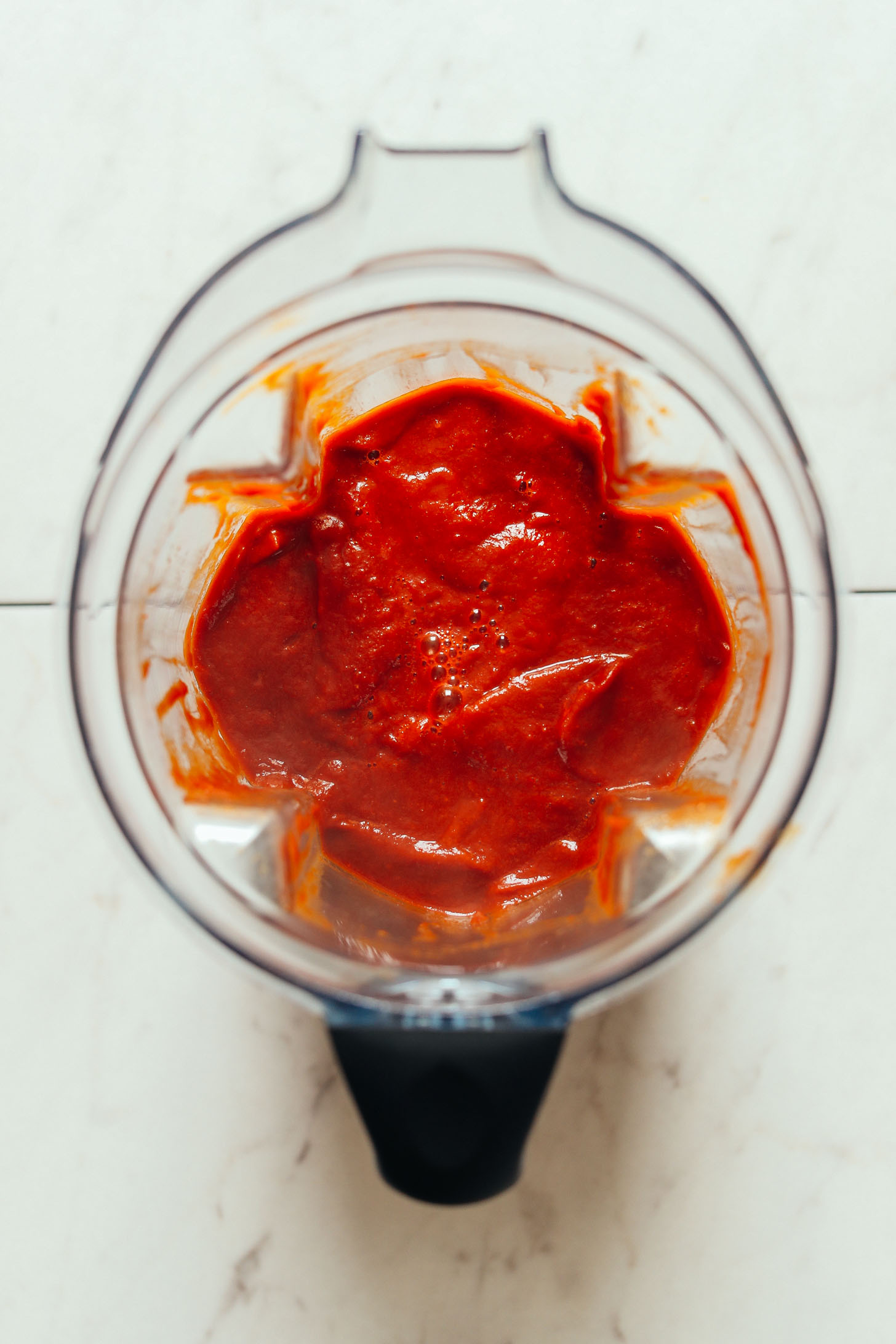 Blender showing the smooth texture of our Spicy Red Enchilada Sauce recipe