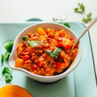 Bowl of our delicious Spicy Mango Chutney recipe topped with fresh cilantro