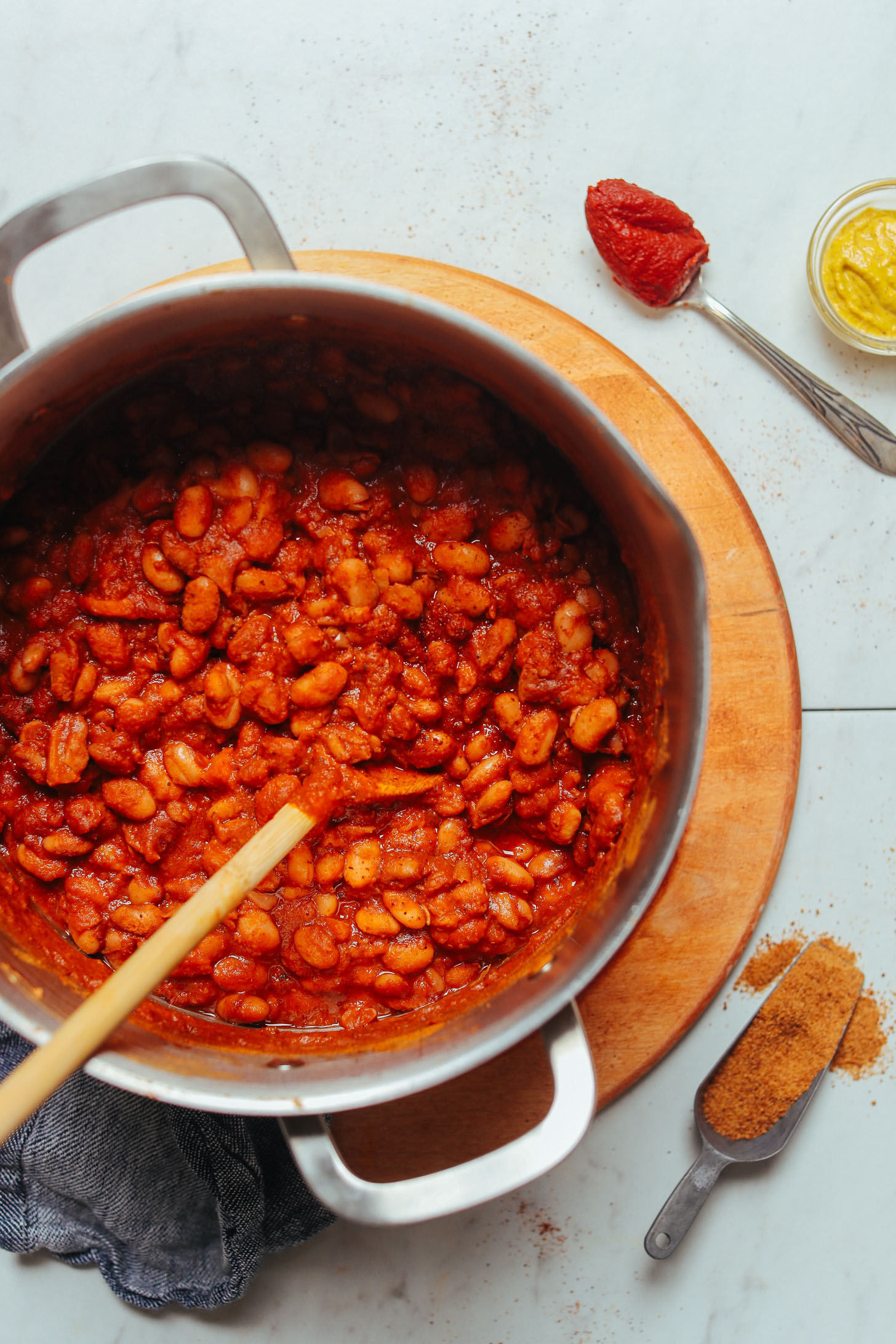 Stirring a big pot of our homemade vegan BBQ Baked Beans