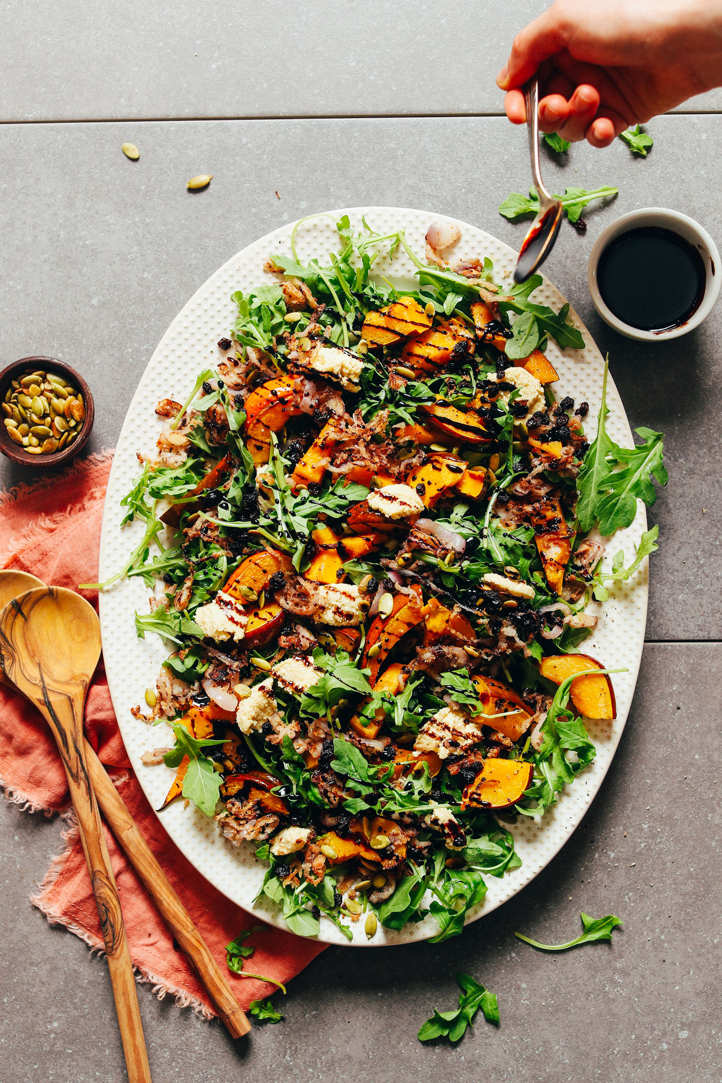 Large platter filled with delicious plant-based Roasted Squash Salad with Nut Cheese and Balsamic