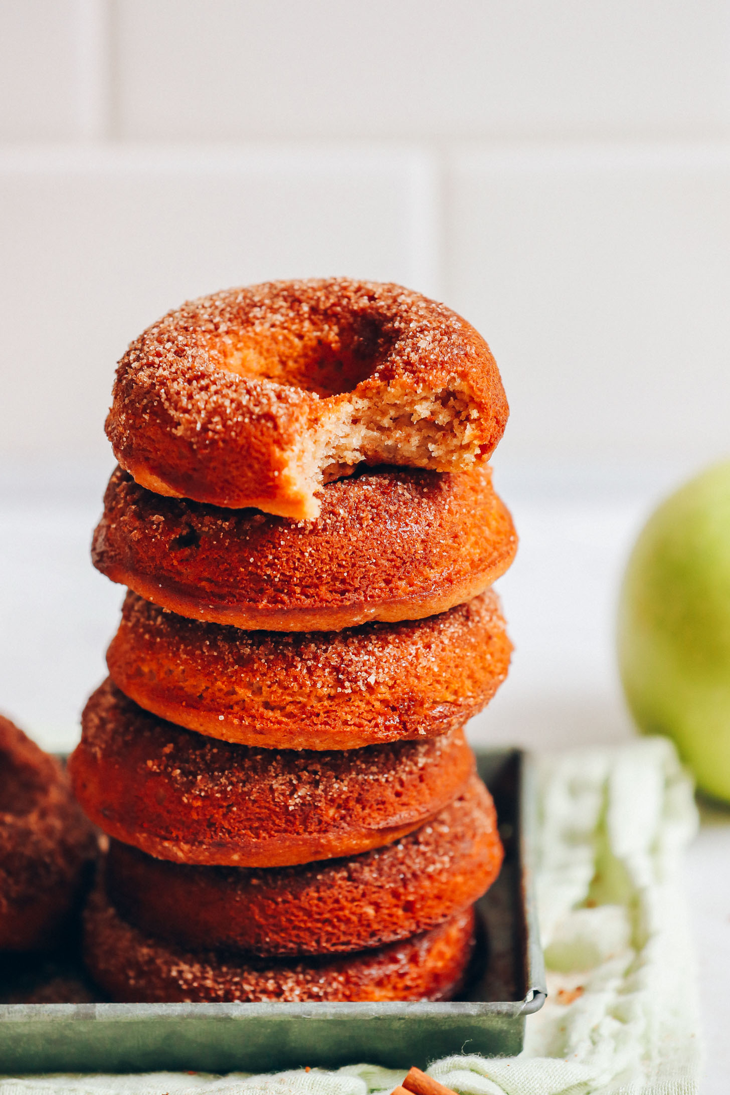 Stack of homemade vegan gluten-free apple cider donuts