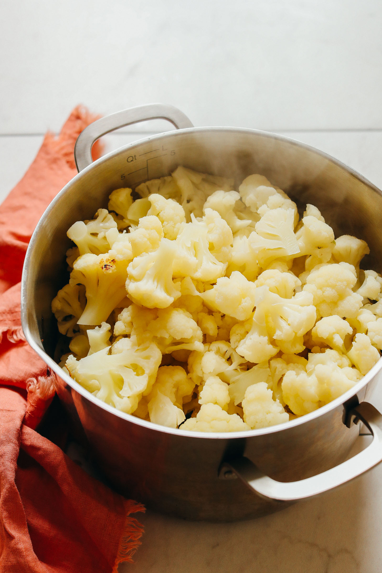 Steaming cauliflower to make homemade Garlic Mashed Cauliflower for a Thanksgiving side