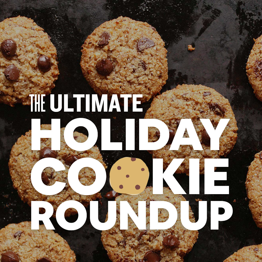 Batch of chocolate chip cookies on a dark background with text overlaid saying The Ultimate Holiday Cookie Roundup