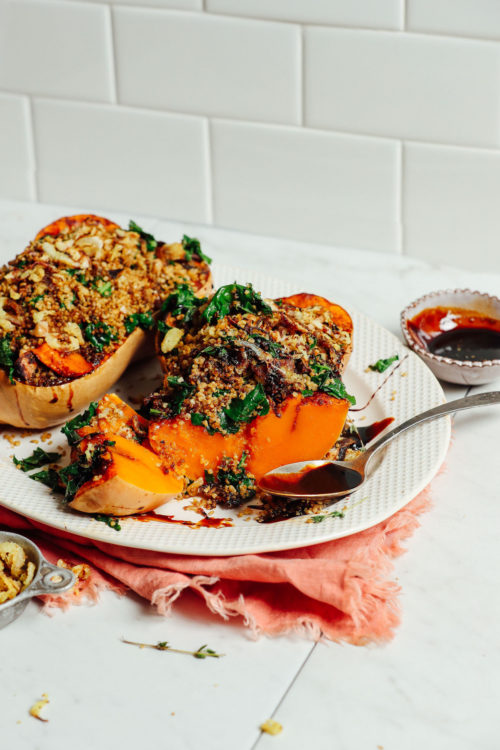 Tray of Stuffed Butternut Squash with Quinoa, Mushrooms, Kale and Balsamic Glaze